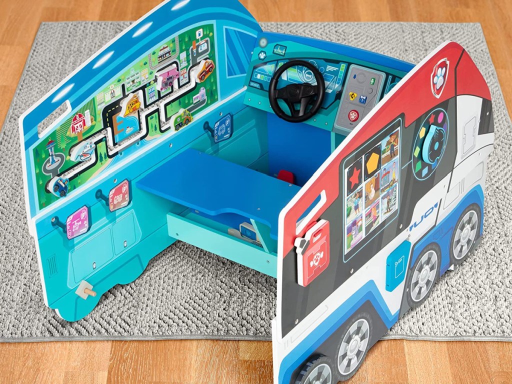 Melissa & Doug PAW Patrol Wooden PAW Patroller Activity Center on display on a rug