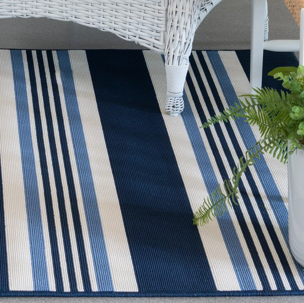 Patio chair on a blue striped rug