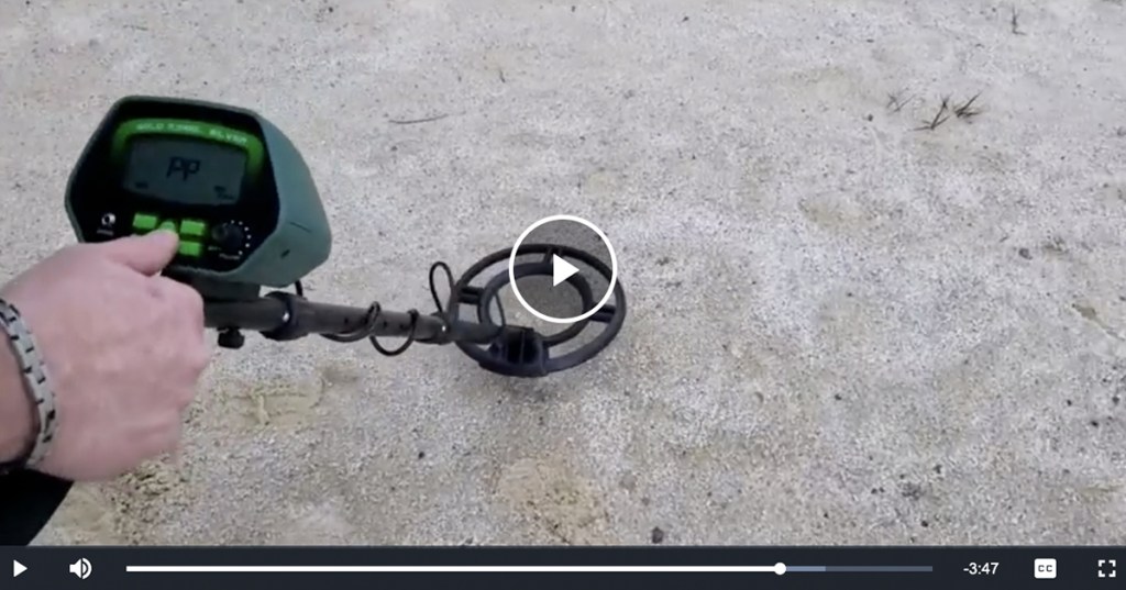 screenshot of video of person using metal detector