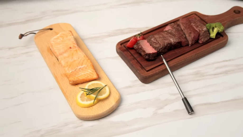 meat thermometer in meat on charcuterie board