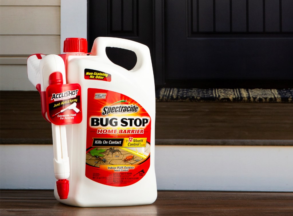 bottle of Spectracide Bug Stop on front steps of house