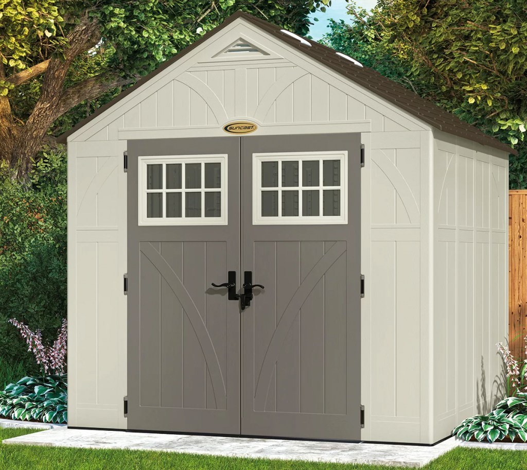 large storage shed with brown doors