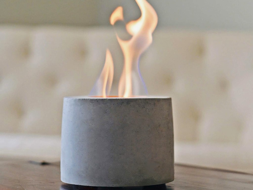 grey mini tabletop fire pit with flame