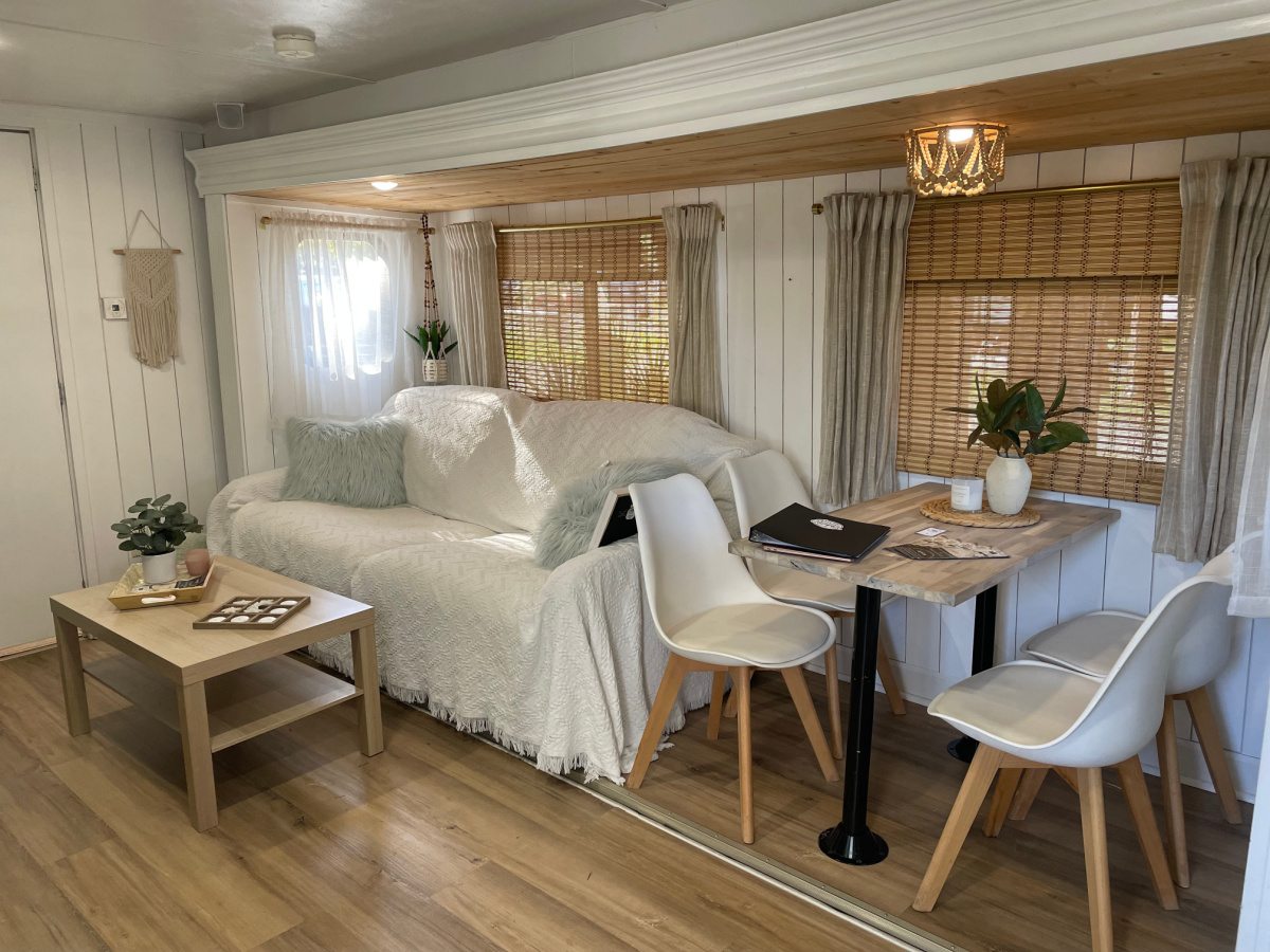 A sofa and dinette set inside an RVshare rental that was used for glamping