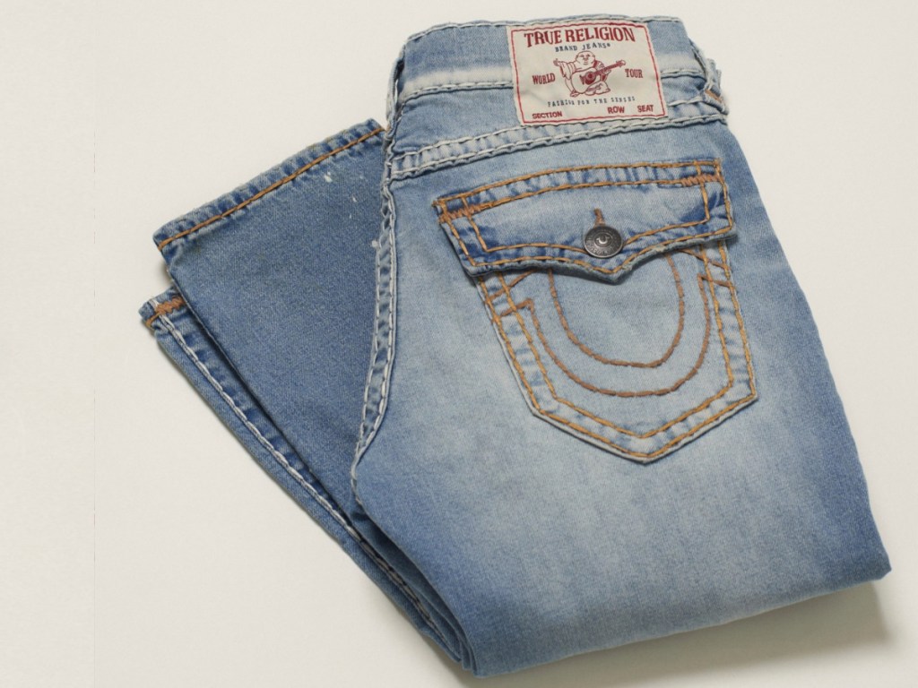 light washed True Religion Jeans featuring stitched pocket