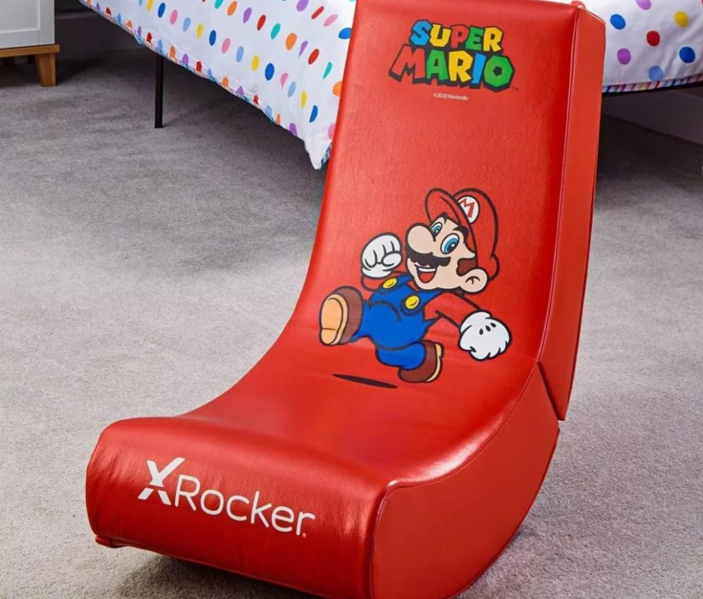 X Rocker Mario Floor Rocker on floor near a bed