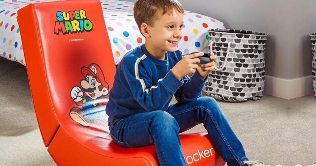 Ypung boy playing video game sitting in a X Rocker Mario Gaming Chair