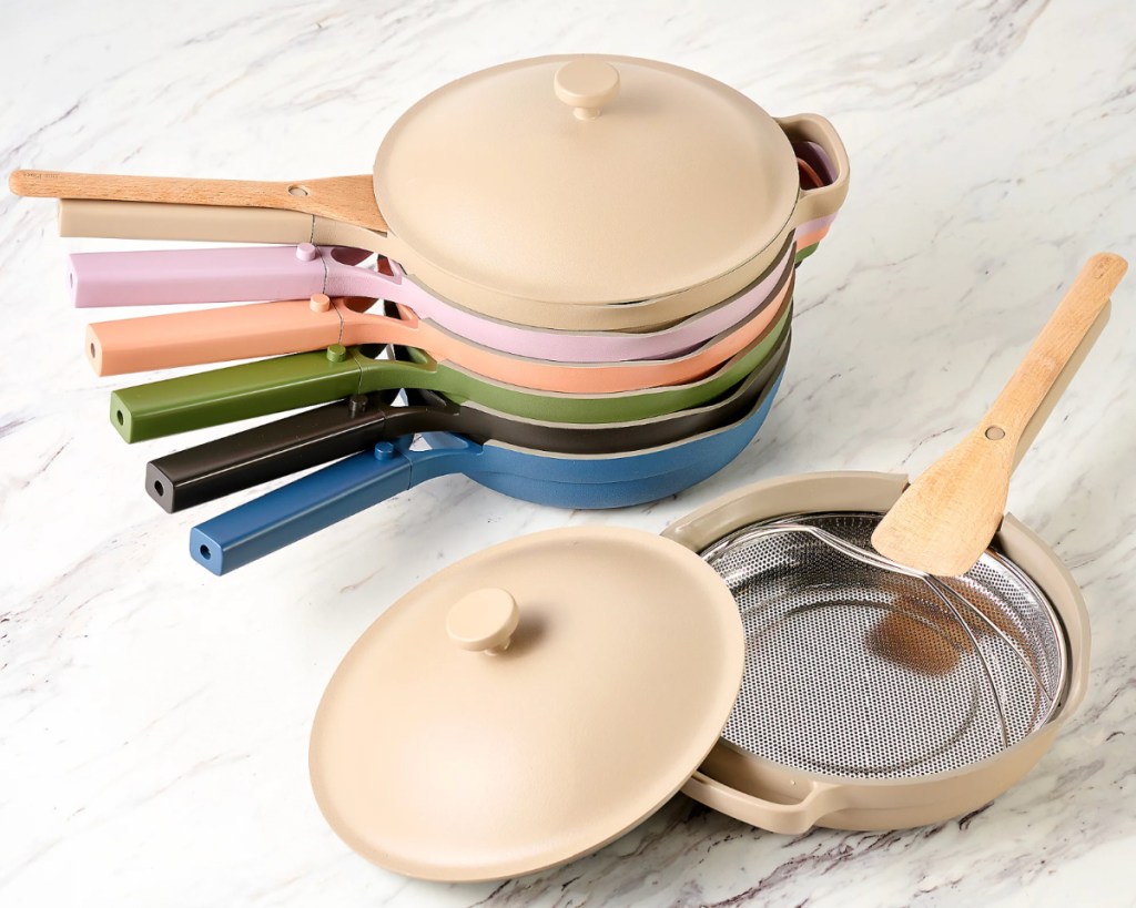 many colorful always pans stacked