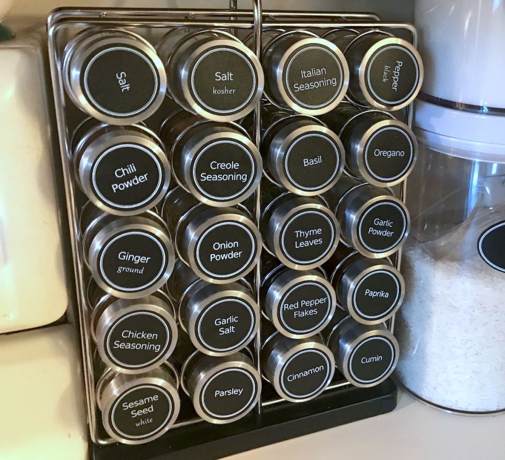 spice rack with various labeled jars on organizer