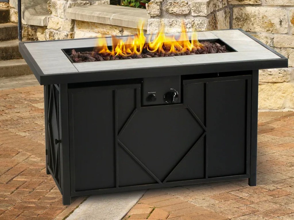 black outdoor table firepit on patio 