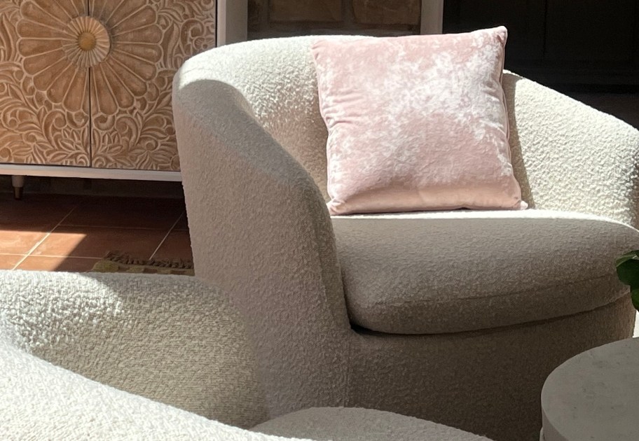 ivory swivel chairs on sun porch