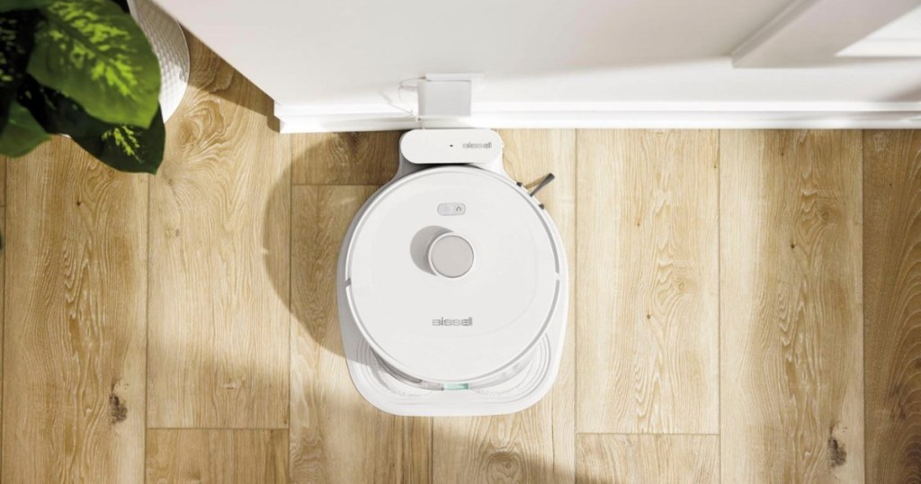 white robot vacuum on charger