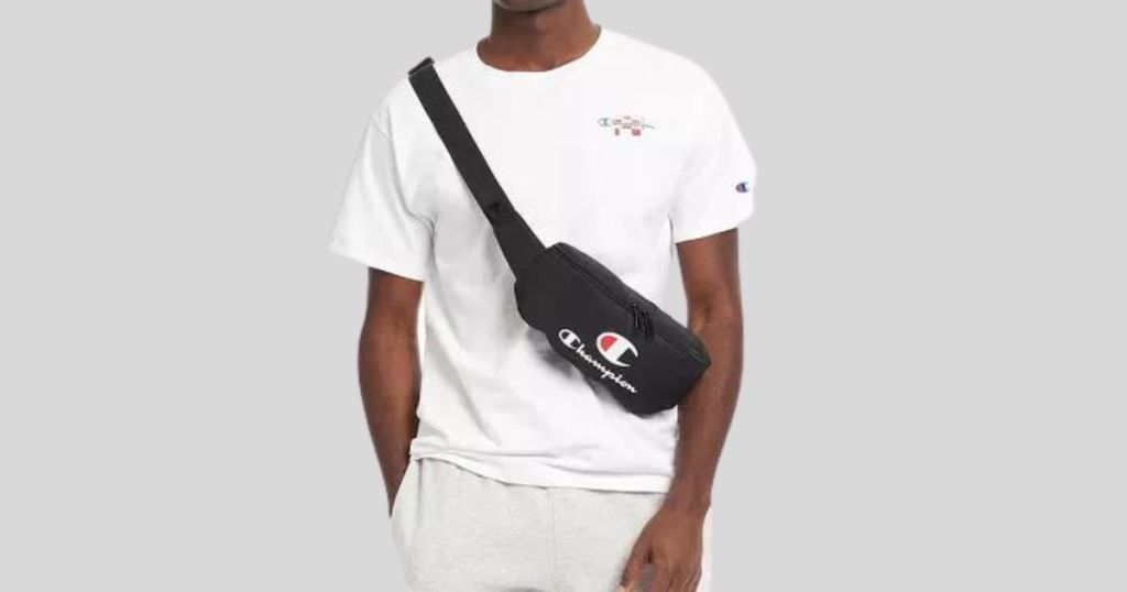 man wearing white t-shirt with black and red Champion belt bag across chest