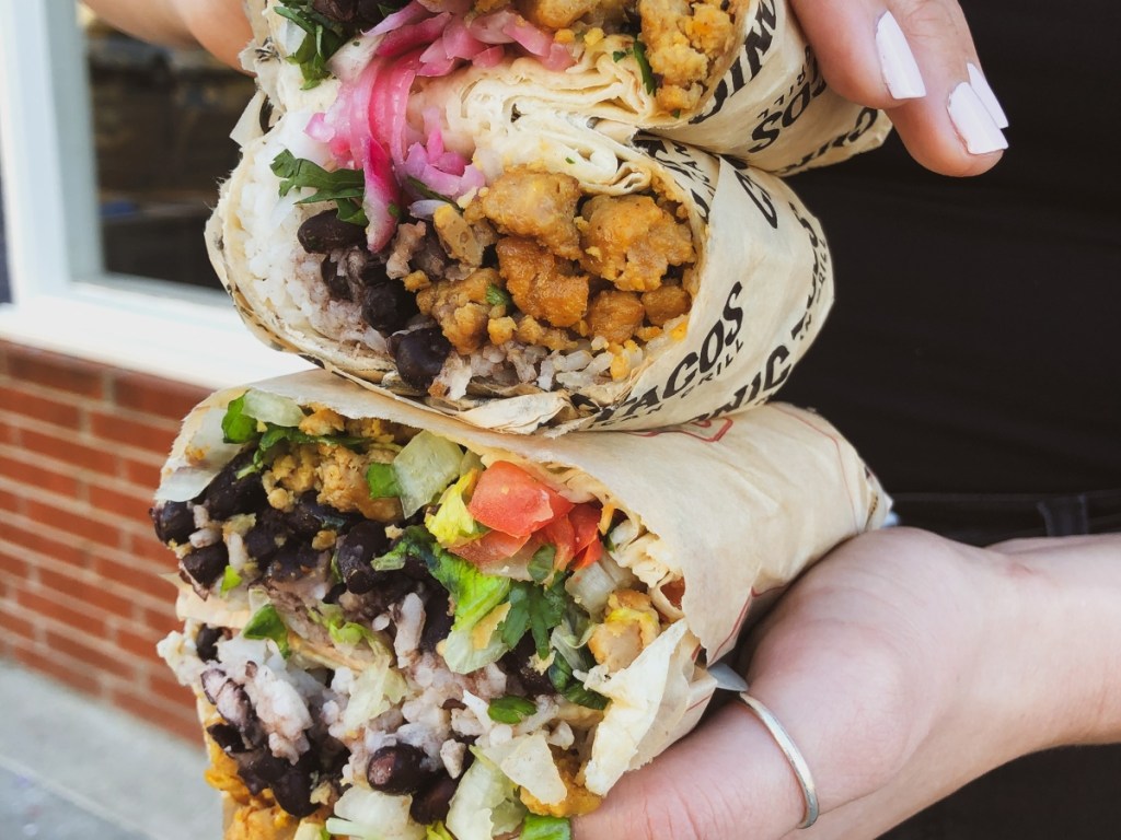 holding 2 burritos cut in half