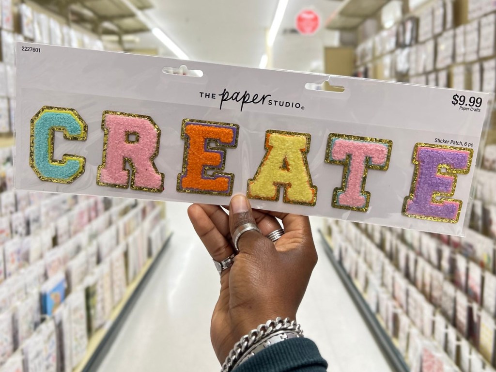 hand holding create iron on patches in hobby lobby