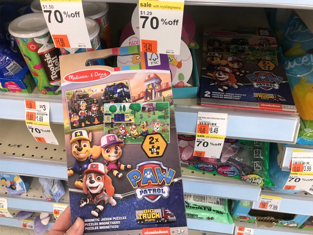 hand holding paw patrol puzzles