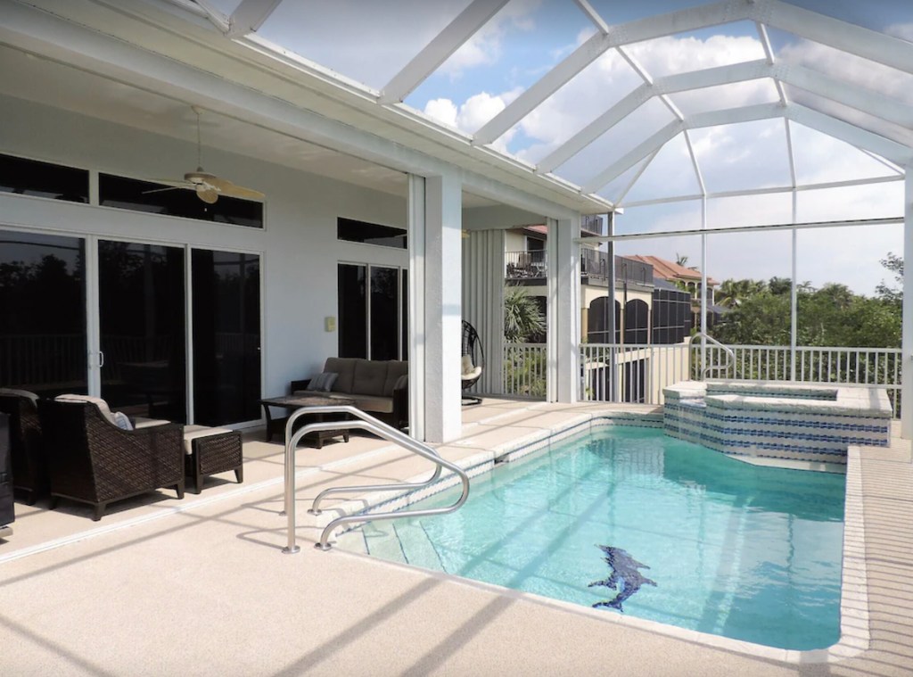 view of pool and covered porch