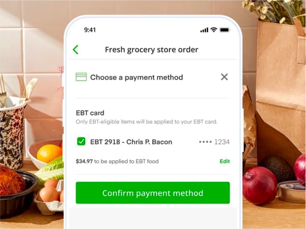 instacart user paying with EBT snap benefits in app on a smartphone