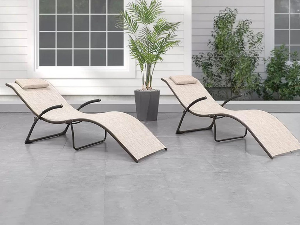 beige chaise lounge chairs on patio