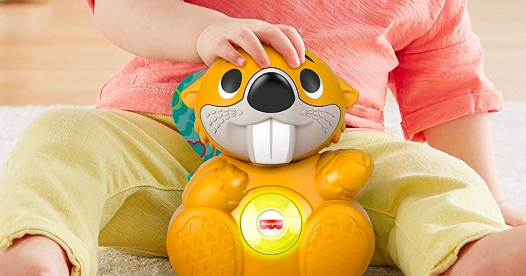 linkimals bopping beaver toy with childs hand on top