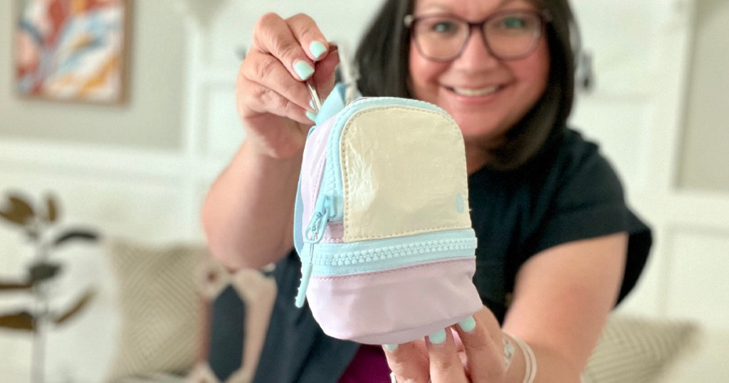 woman holding lululemon city adventure backpack