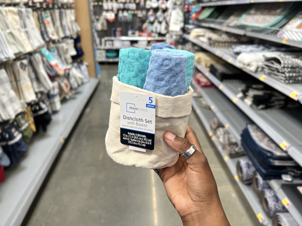 holding Walmart dishcloth set 