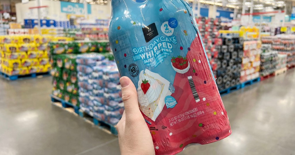 hand holding members mark birthday cake whipped topping in sams club