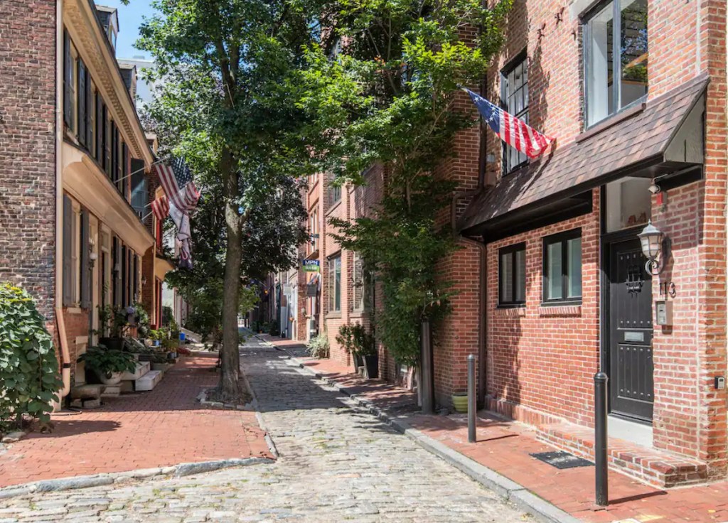 old cobblestone road with townhomes