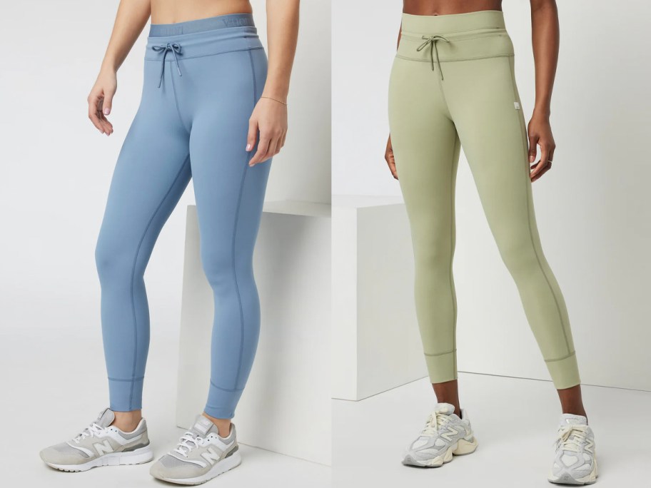 two women wearing blue and green leggings 