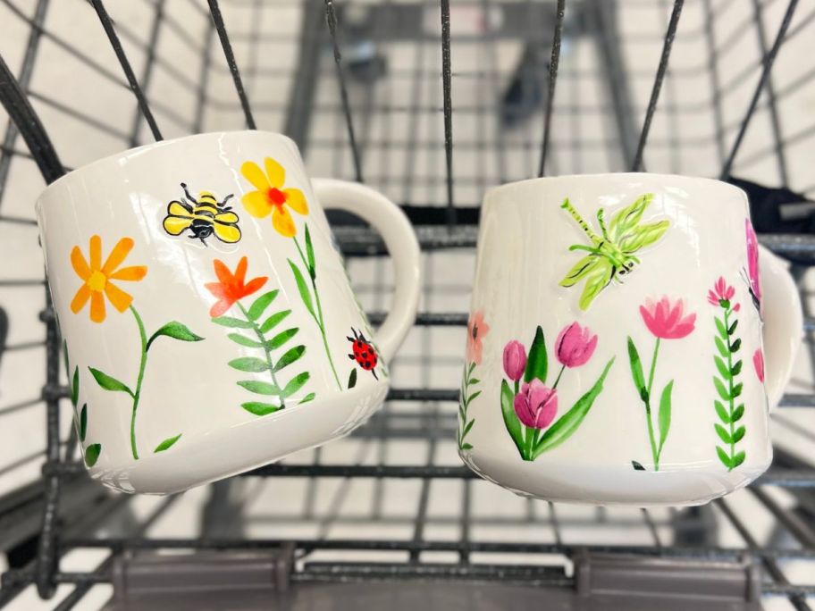 white ceramic coffee mugs with spring flowers, butterflies and bees in walgreens cart