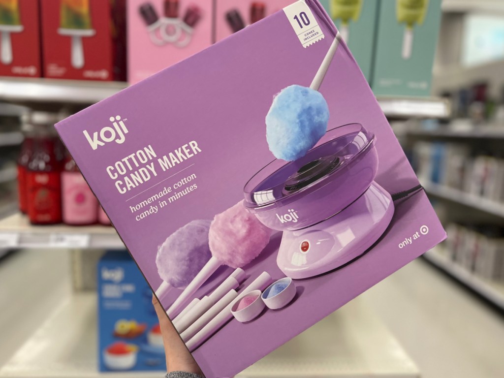 woman holding box of Koji Cotton Candy Maker at the store