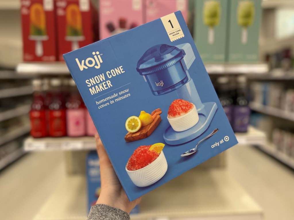 woman holding box of Koji Snow Cone Maker at the store