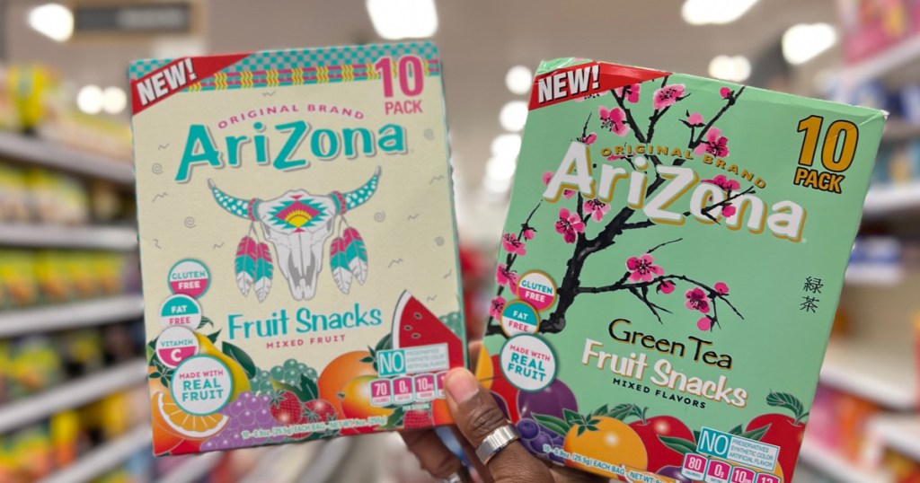 woman holding two AriZona Fruit Snacks 10 Pack at the store