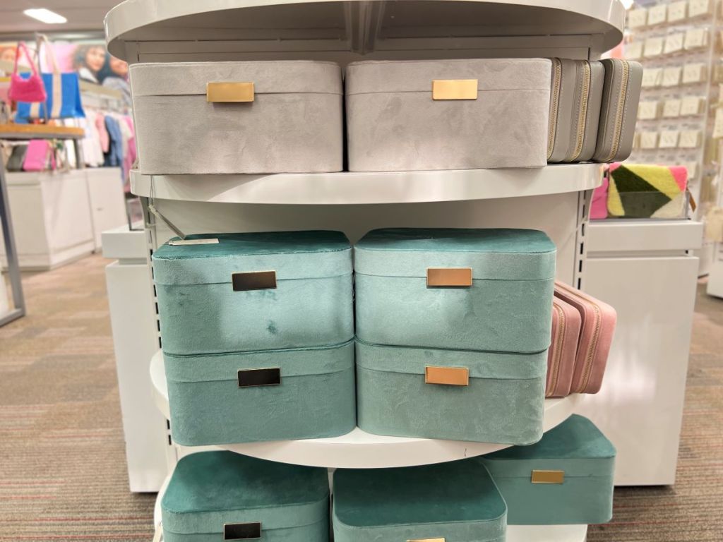 Display of grey and teal jewelry boxes on shelves at Target