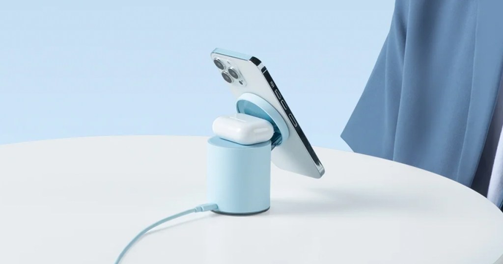 iphone and airpods on a blue wireless charger