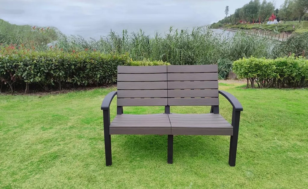 Brown bench sitting by a lake