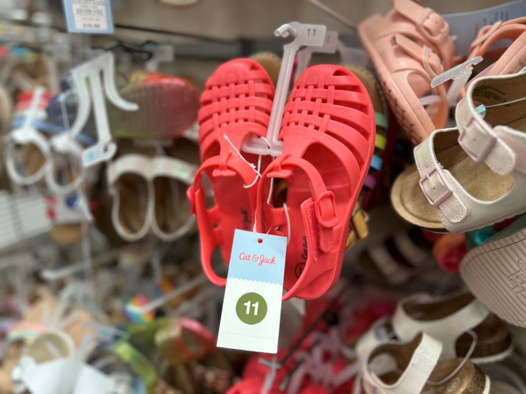 Pair of red jelly sandals on a hanger at Target