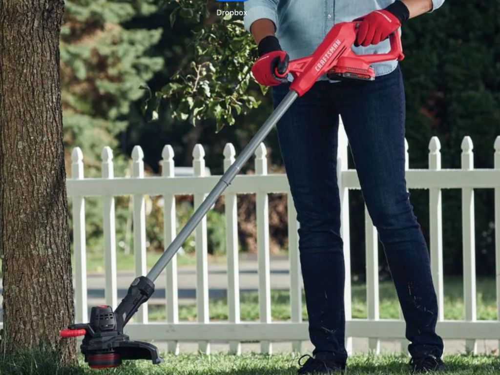 woman using a Craftsman String Trimmer