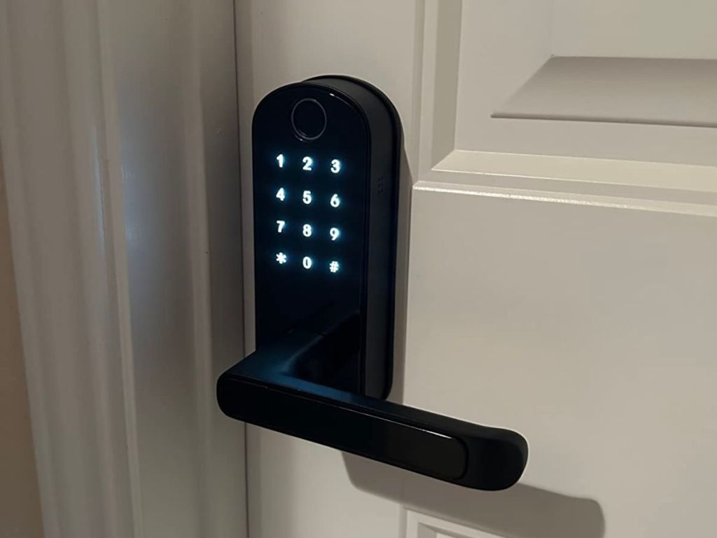 Black lock with lighted numbers on a door