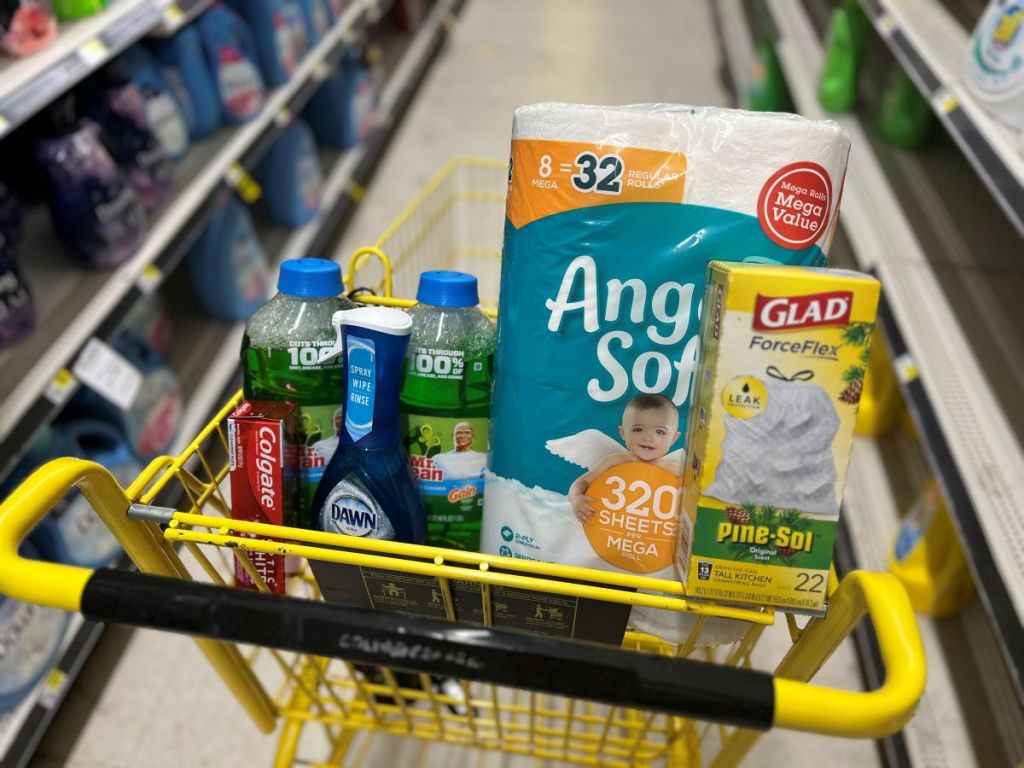 Dollar General cart with toilet paper, trash bags, toothpaste and cleaning products