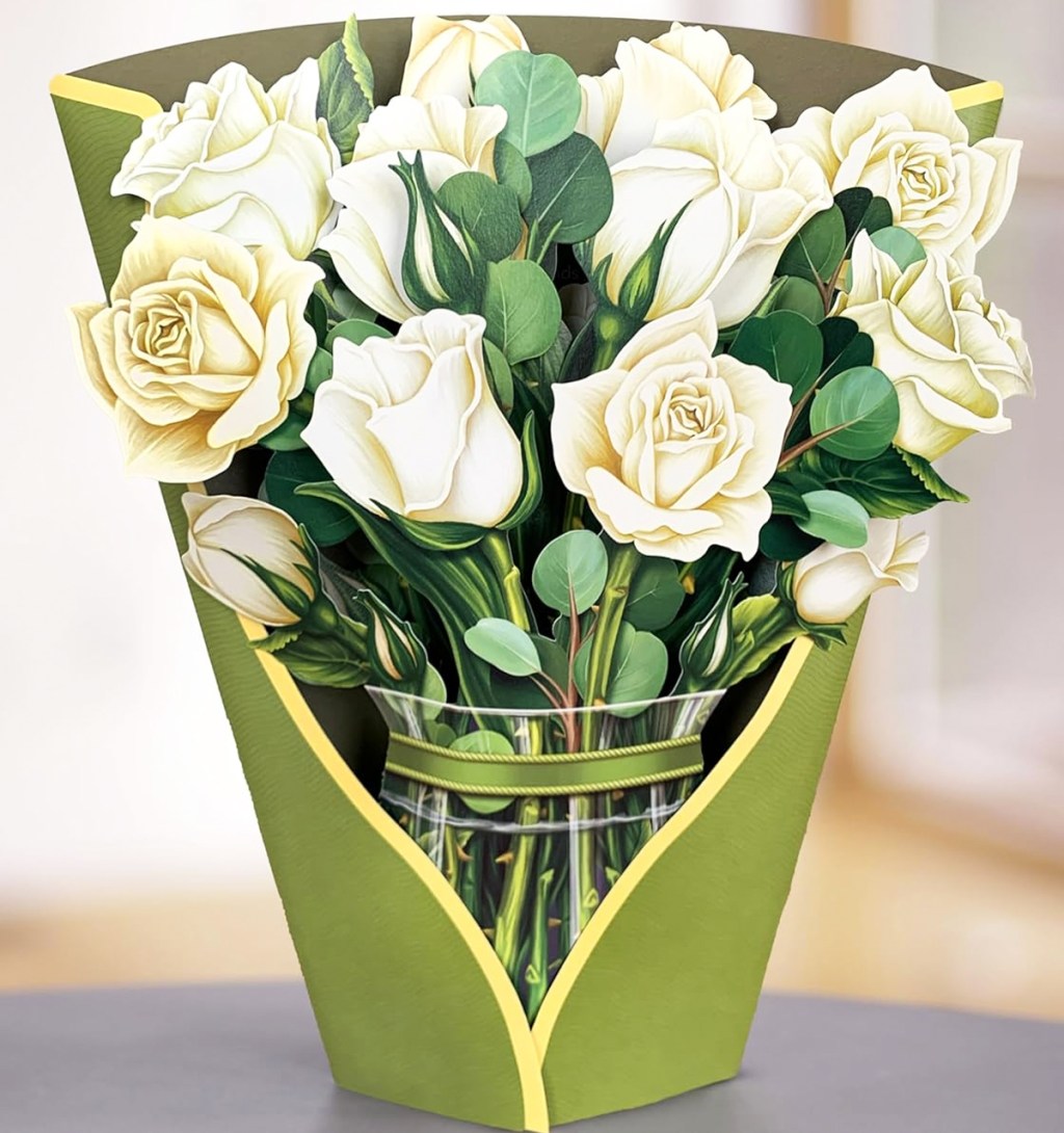 paper bouquet of white roses on table