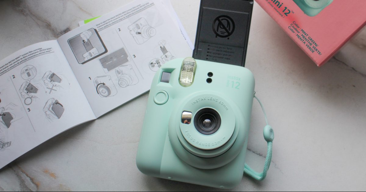 The Fuji Instax Mini 12 Camera with instructions booklet and film