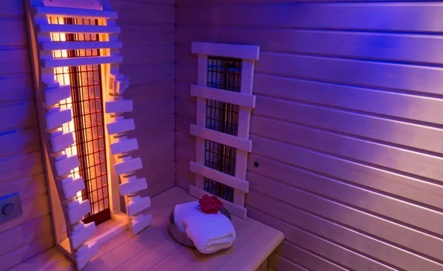 infrared sauna with stack of towels