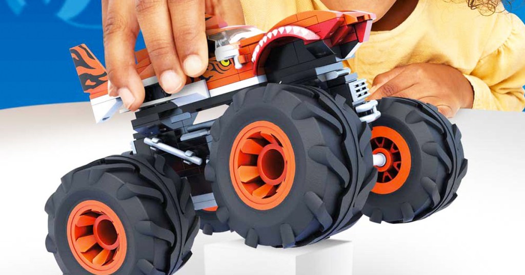 child playing with Mega Construx Hot Wheels Tiger Shark Monster Truck