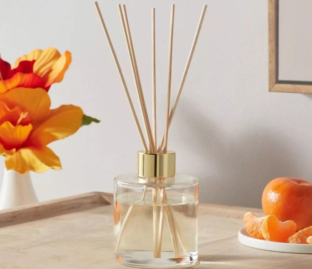 Opalhouse Reed Diffuser on a table next to a plate of mandarin oranges