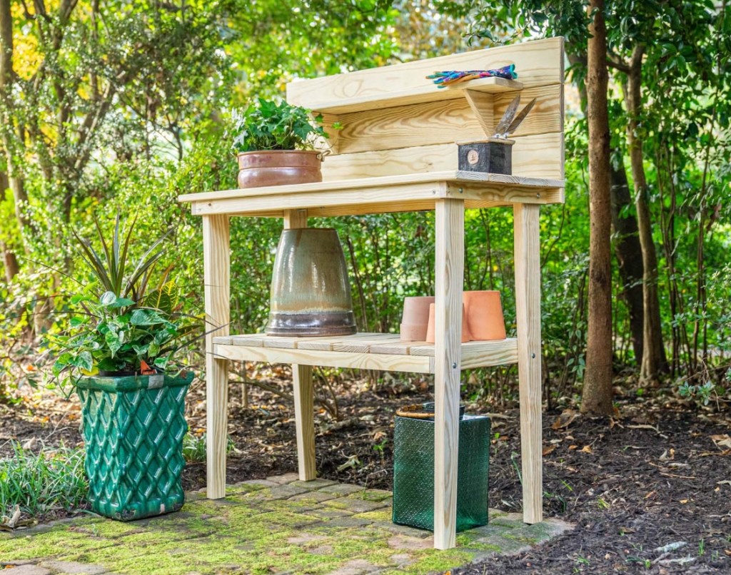 Pine table with planting supplies on it