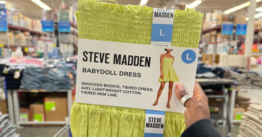 Hand holding up a Steve Madden Babydoll dress