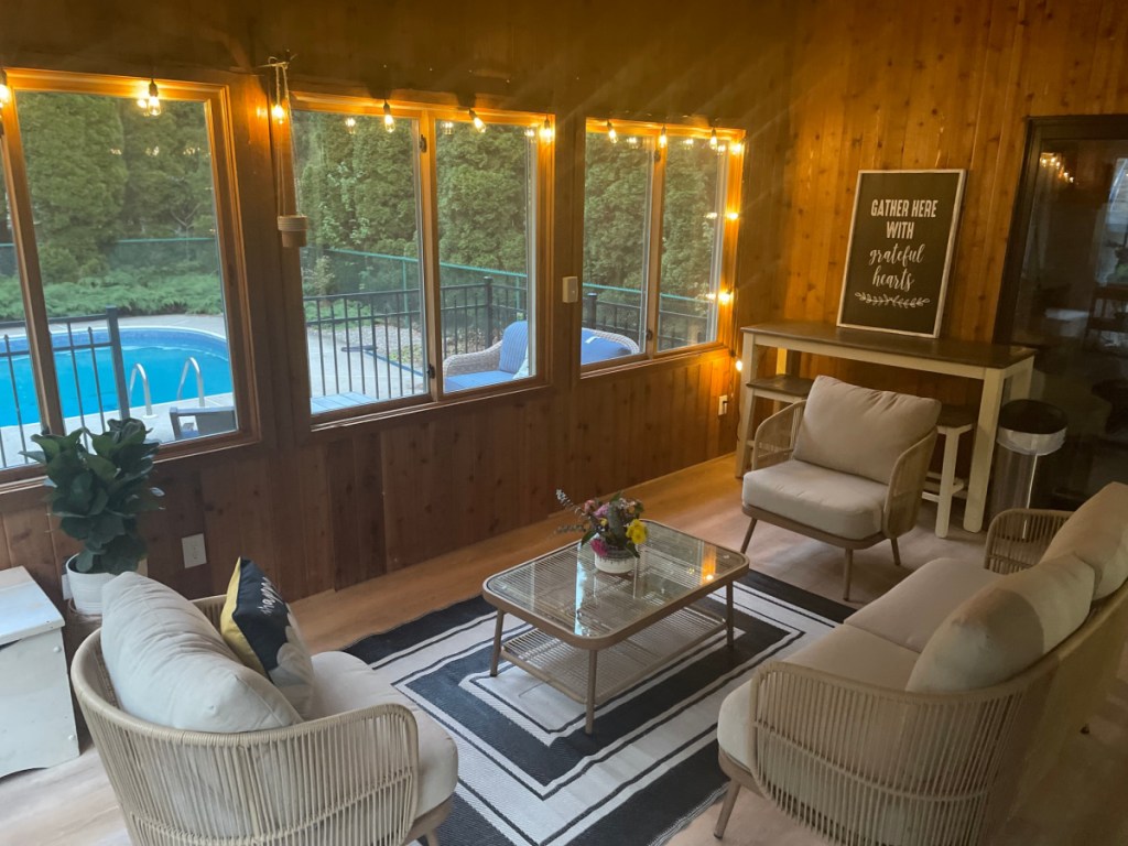 String Lights hung up around a sunroom window 