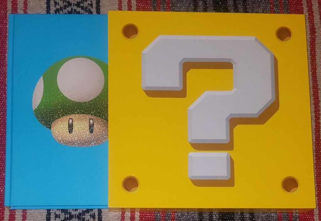 Super Mario Encyclopedia book and box