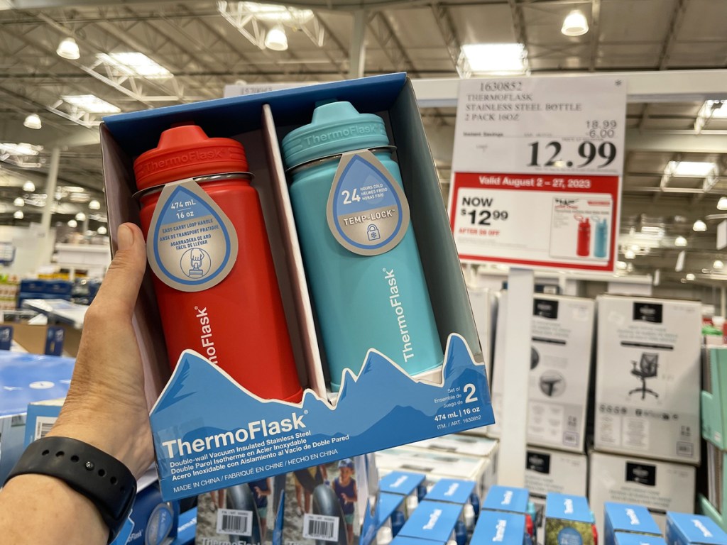 hand holding up a 2-pack set of ThermoFlask Bottles